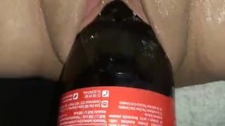 One Litter Coke Bottle stretching some loose amateur